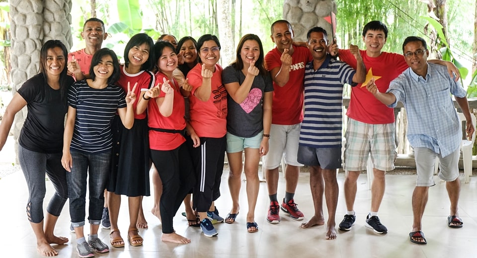 The members of Love Team (L-R): Octaviana Ferreira Agostinho, Natalino de Araujo, Theint Theint Aung, Khin Pyone Nwe, Ma. Genesis C. Reyes, Avelina Isabelita da Costa, Ei Ei Thein, Karen S. Bautista, Judith O. Jimena, Charlie B. Batin, Xisto Martins, Ho Ngoc Cuong, Ye Tun.