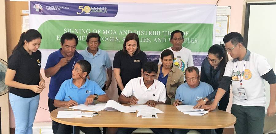 Seated (L-R): Mr. Victoriano Petina, Jr., President of RDPA; Mr. Rolly C. Mateo, Chairman, BSNMPC; and Mr. Romeo S. Doton, Chairman, PPMPC. | Standing (L-R): Ms. Sarah Qui&ntilde;ones, SEARCA Project Coordinator; Mr. Reynaldo D. Paneda; Science Research Analyst/AI Coordinator of PCC at DMMMSU; Mr. Ricardo C. Eblogan, Sr., Vice President, RDPA; Ms. Nancy Landicho, SEARCA Program Specialist; Dir. Gloria M. dela Cruz, PCC Center Director at DMMMSU; and Mr. Nicasio E. Olipas, Jr., Vice Chairman of PPMPC.
